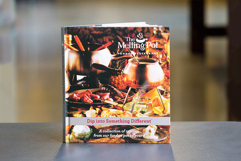 The Melting Pot Cookbook on Table