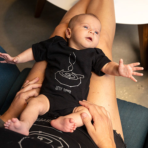 Baby in Little Dipper Onesie with Mother