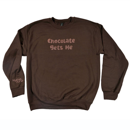 Chocolate Gets Me Sweatshirt on Table